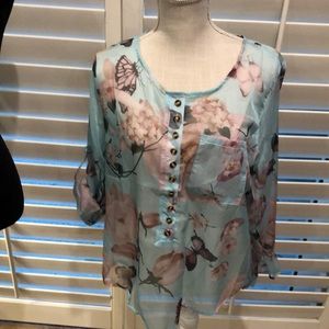 Very feminine floral pull over blouse.